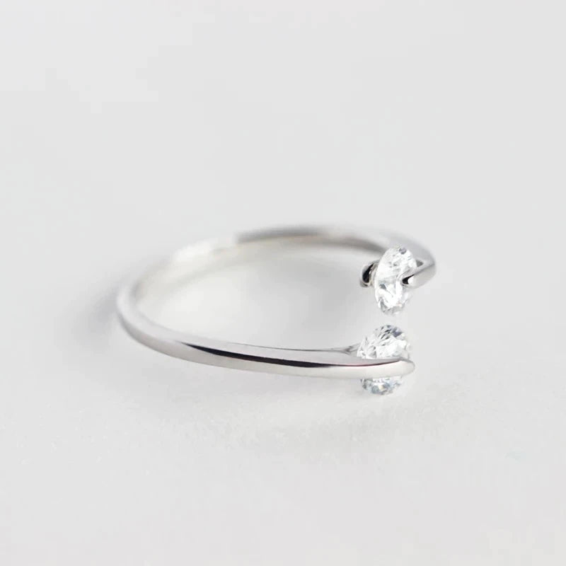 Sterling silver ring with suspended CZ diamonds