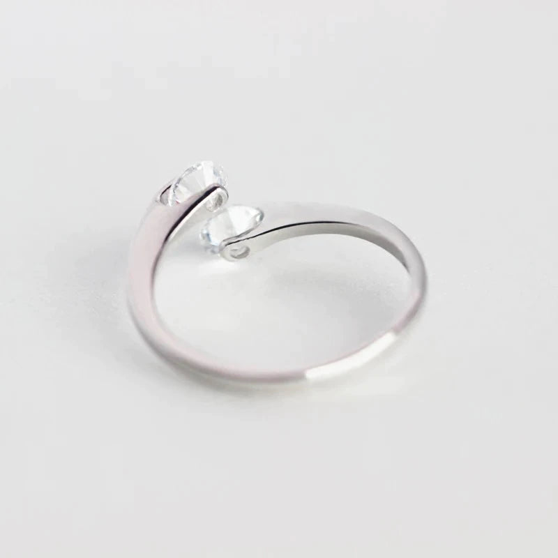 Sterling silver ring with suspended CZ diamonds