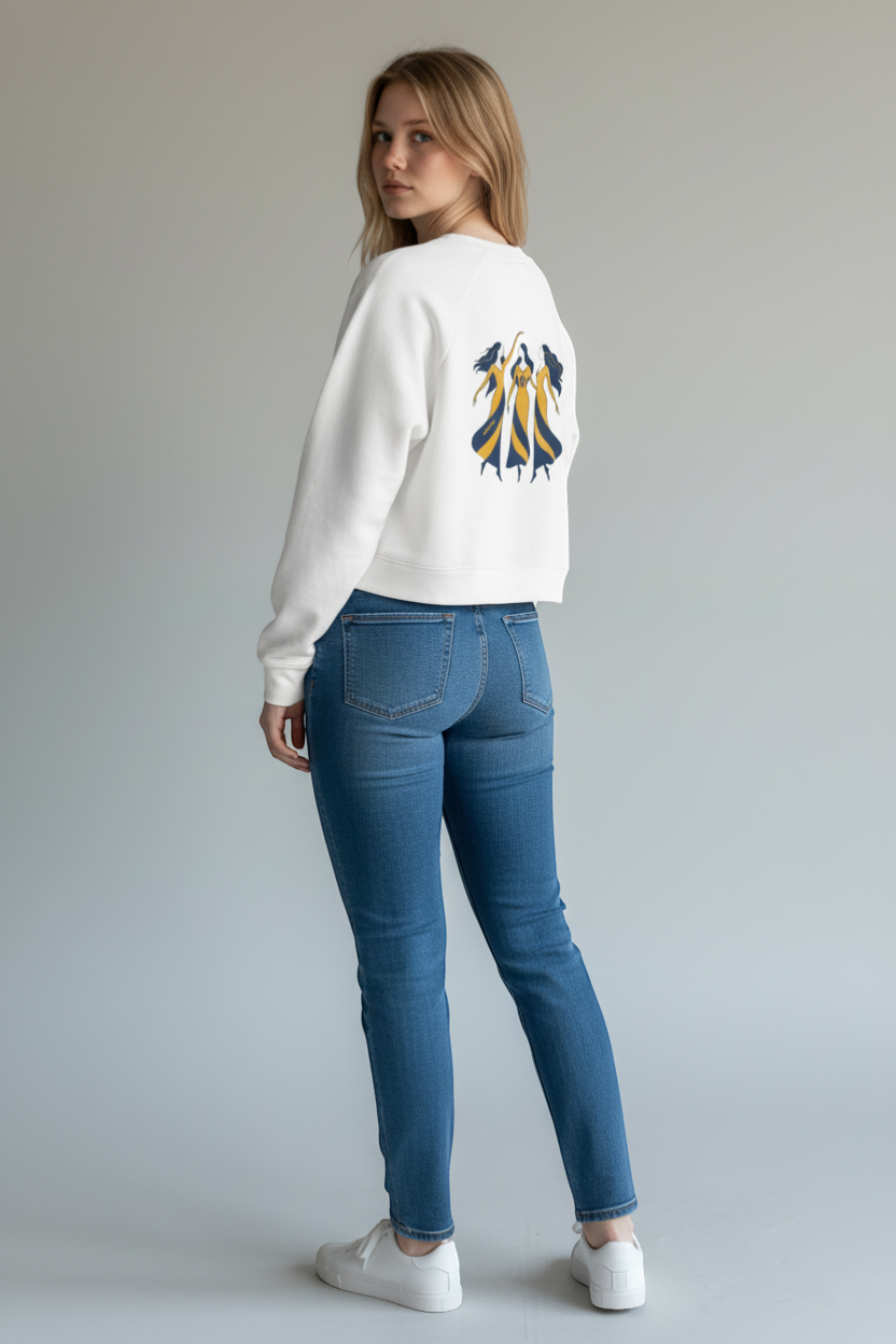 Ce Fain! white cropped fleece pullover with raglan sleeves and a vintage graphic of three women in yellow and blue dresses.