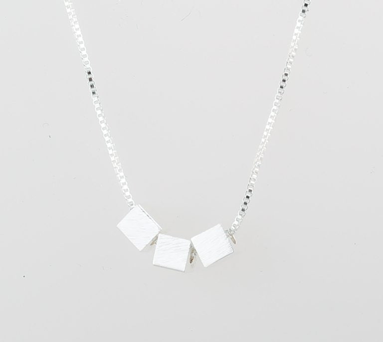 Brushed-silver 3-cube pendant