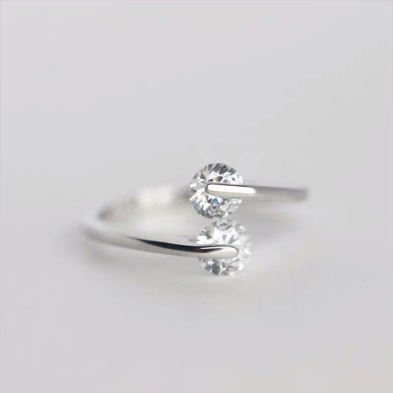 Sterling silver ring with suspended CZ diamonds