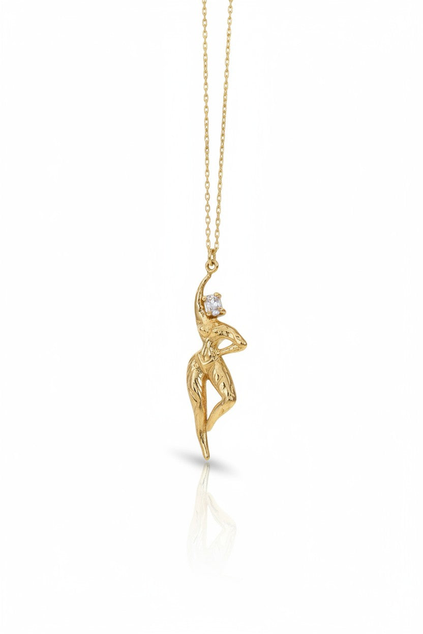 Ce Fain! Aethera gold-plated silver pendant featuring a sculpted goddess figure with a small white stone on a fine chain