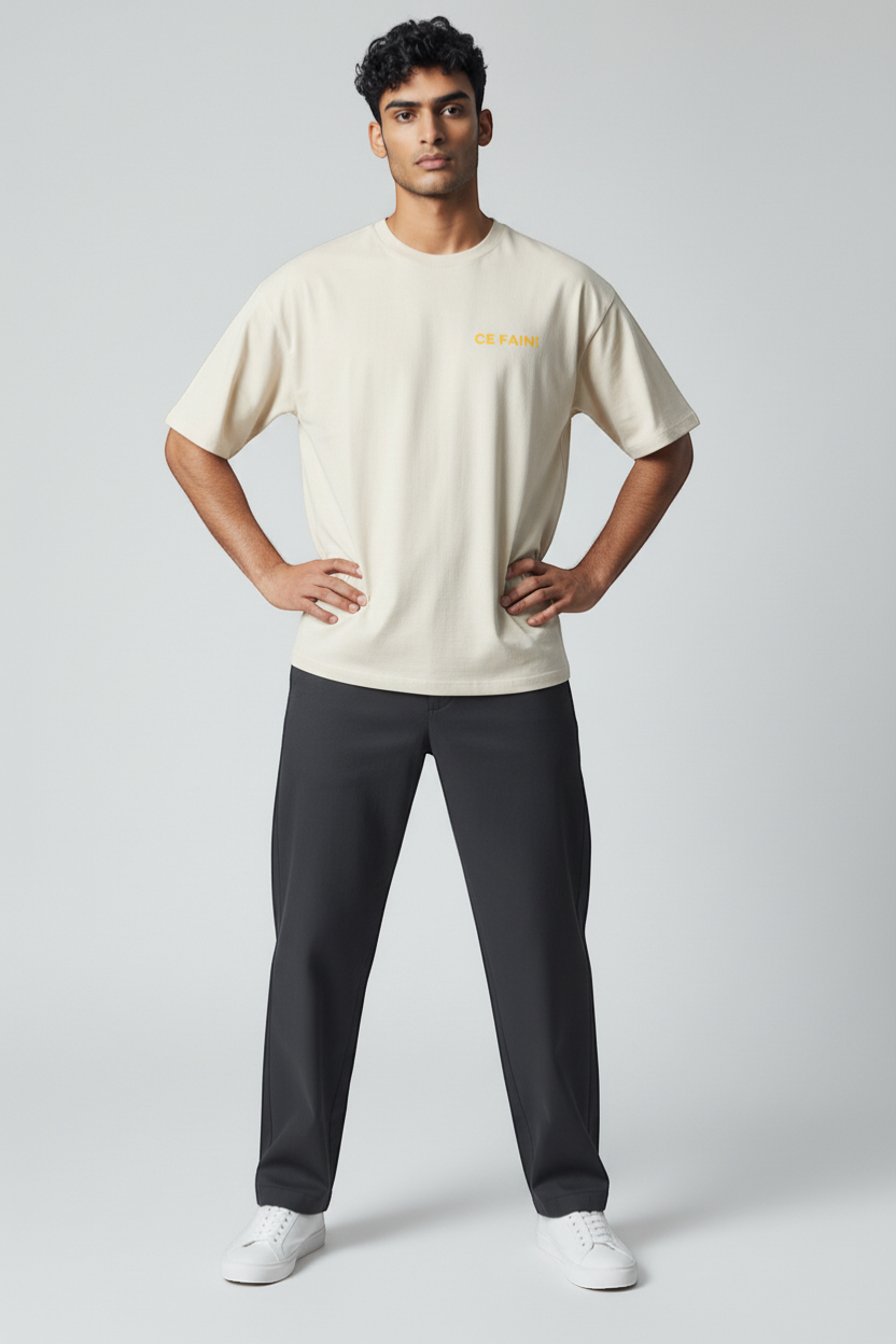 Ce Fain! natural cream organic cotton t-shirt with yellow text on chest and graphic on back.