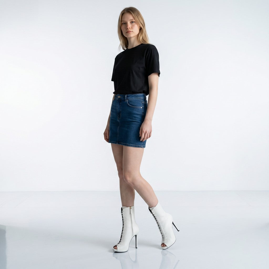 Ce Fain! white nappa leather peep-toe ankle boots with high heels and lace-up front worn by a model.