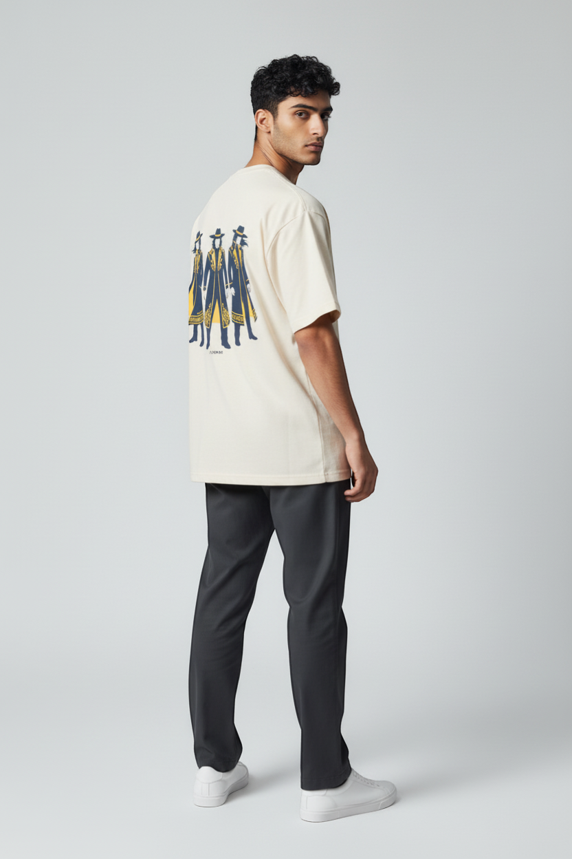 Ce Fain! cream organic cotton t-shirt with a graphic of three figures in dark blue coats and yellow accents.