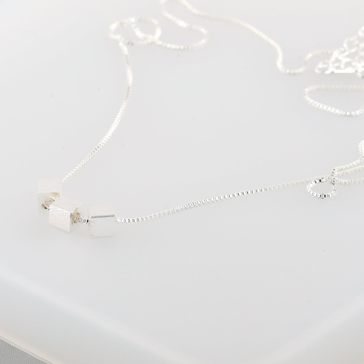 Brushed-silver 3-cube pendant